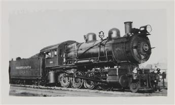 (TRAINS--PENNSYLVANIA RAILROAD) A binder assembled by the artist Lewis Smith with approximately 280 snapshots of steam locomotives.